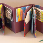 Accordion fold book with pockets, mixed media. NFS