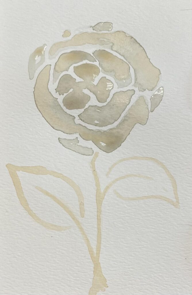 A pale brown flower painted with tea.