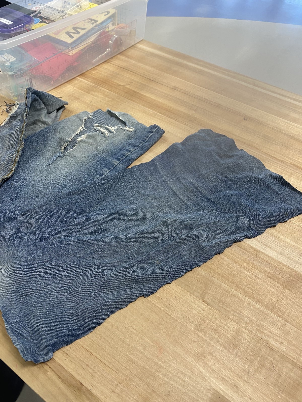 Denim panels cut from a pair of worn out jeans
