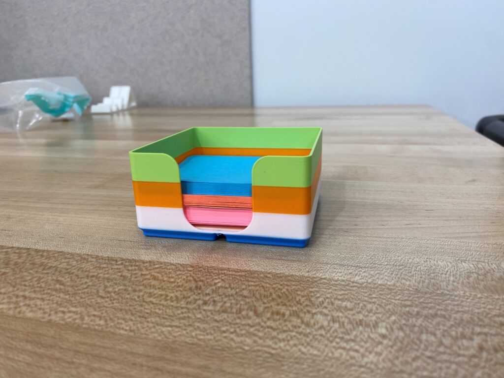 Multicolored sticky note holder.