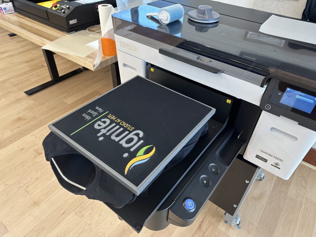 Black t-shirt after printing Ignite logo in Epson Surecolor printer.