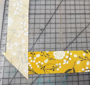 Fabric strips laying perpendicular to each other with the "right" sides facing each other 