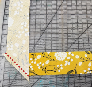 Dotted line above the strips to indicate a 1/4" seam allowance