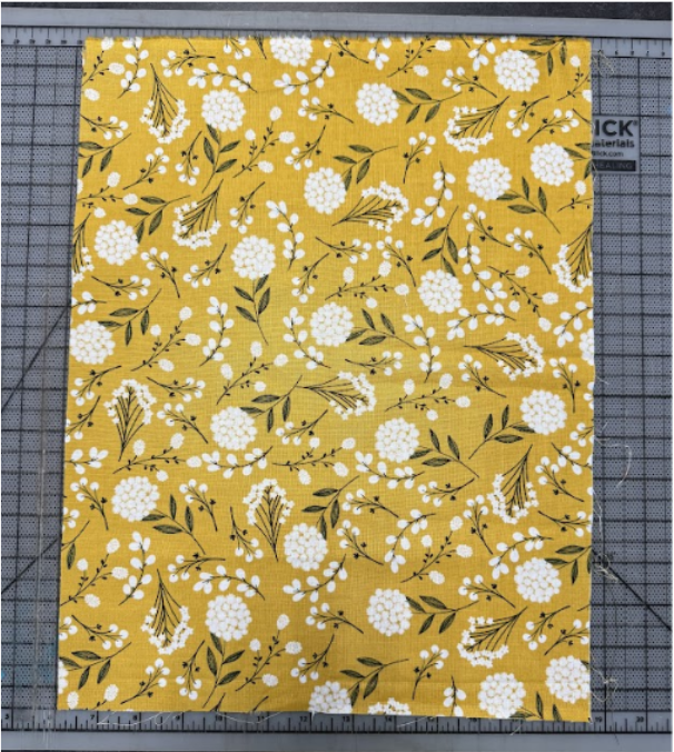 A rectangle of fabric with the pattern of the fabric facing up