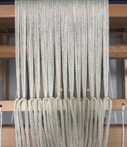 All threads secured to take up wheel.