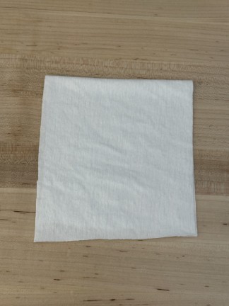Square of white fabric.