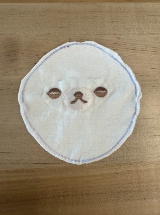 Layers cut into circular shape around sewn edge.