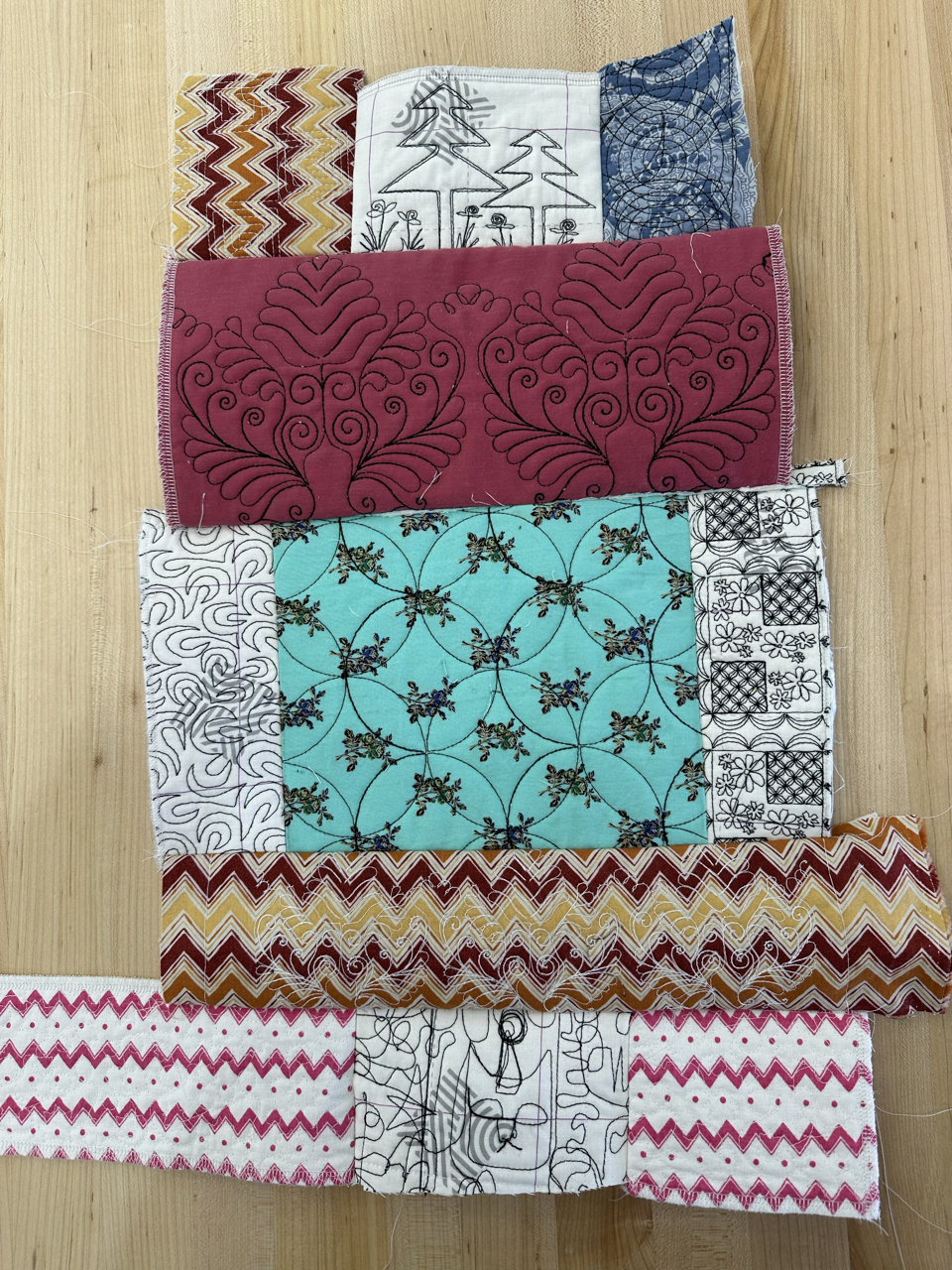Quilted panels laid out for sewing.